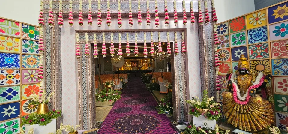 Colourful patola canopy mandap with white floral columns